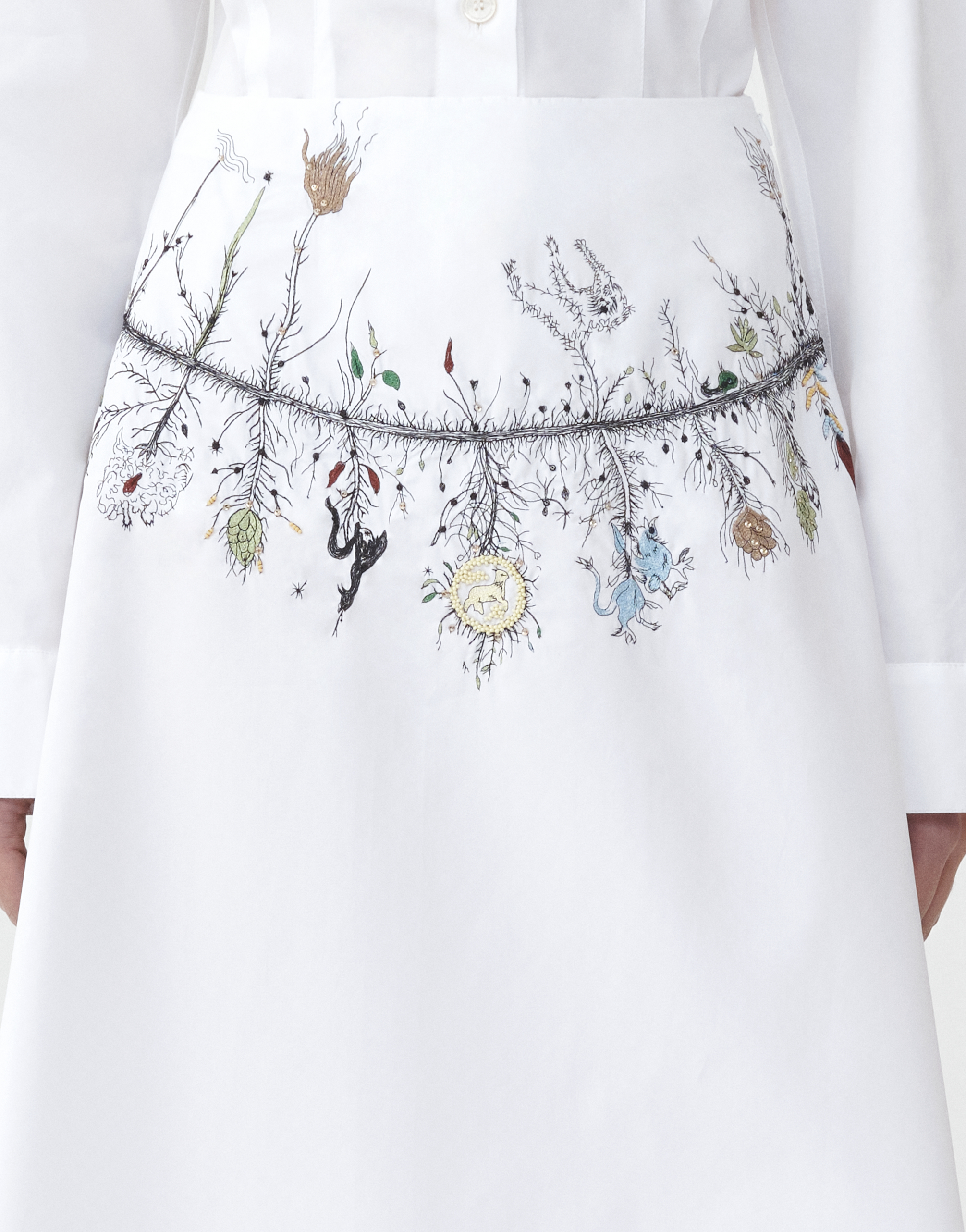 Embroidered top on skirt